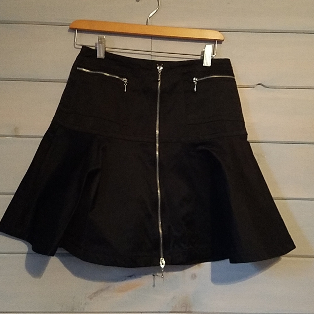 Short Skirt with long zipper in front and 2 packet zippers.